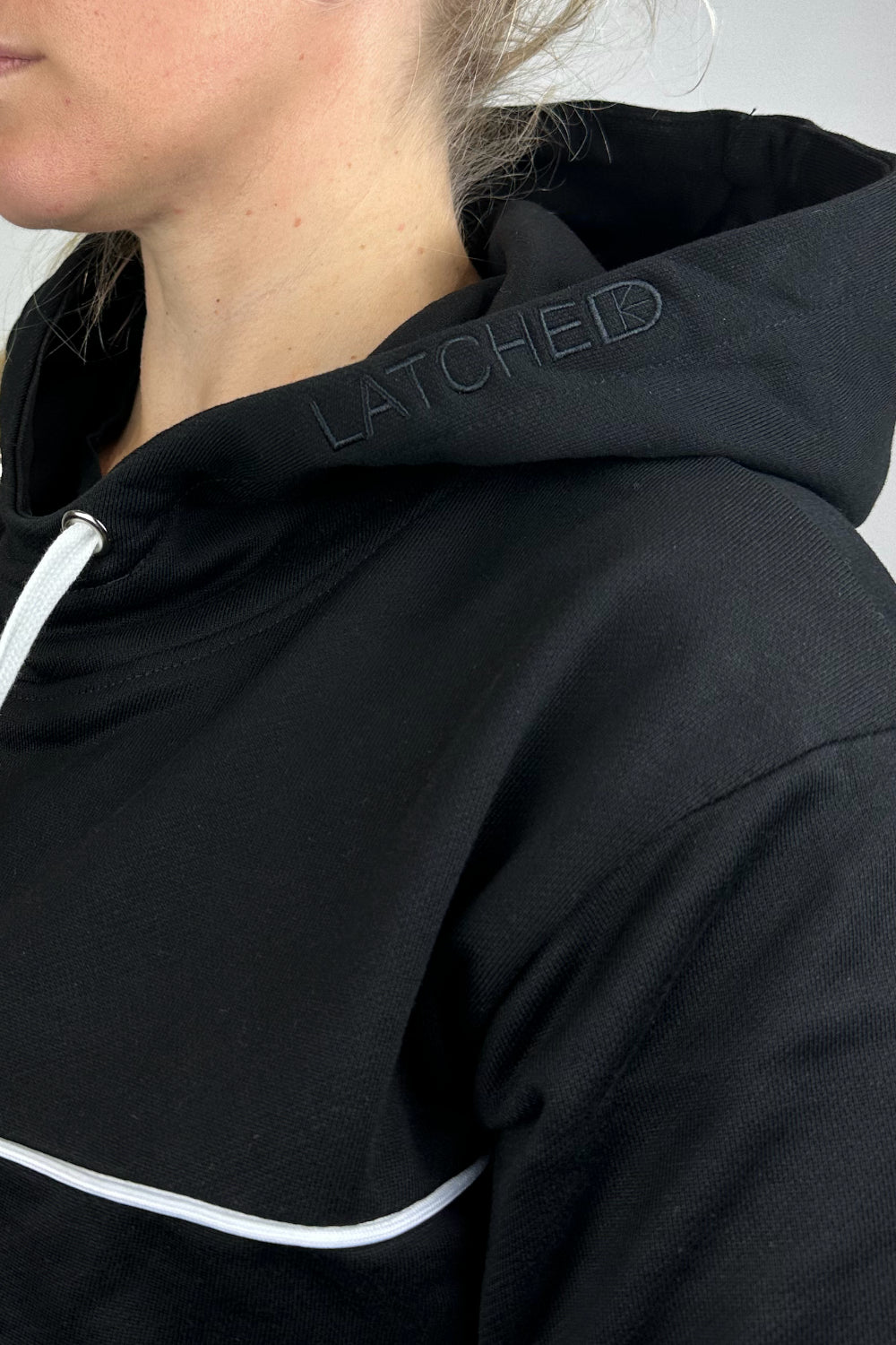 Black maternity and breastfeeding hoodie with side zips hood detail close up