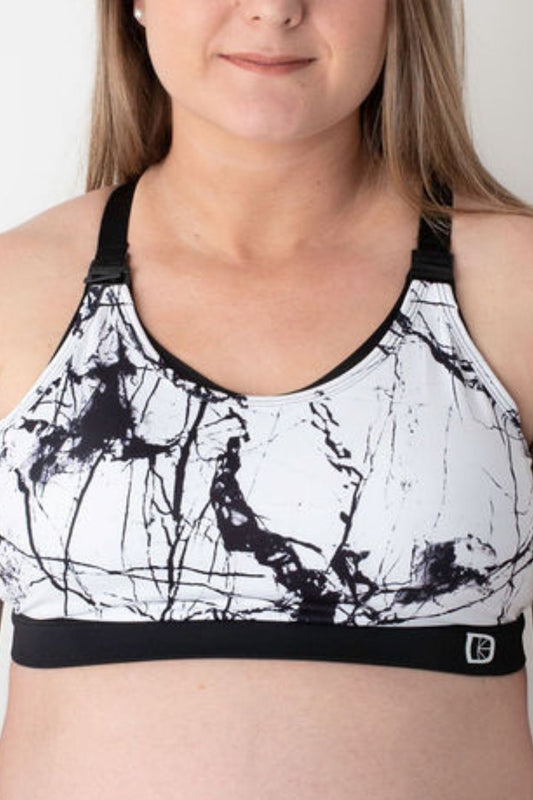 Front view of black and white marble pattern breastfeeding sports Bra