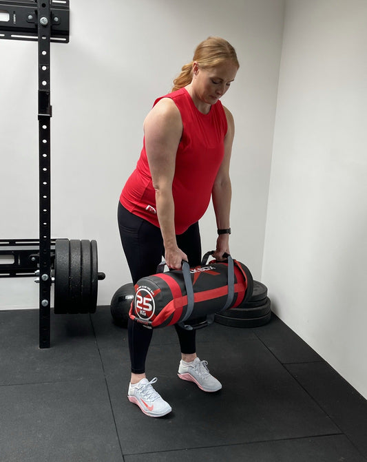 Maternity vest in red, modelled in gym